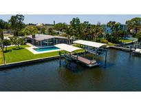 Beautiful waterfront home featuring a pool and private boat dock, offering stunning views and outdoor living at 263 87Th N Ave, St Petersburg, FL 33702