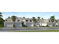 Charming townhome featuring a two-car garage and beautifully landscaped front yard, perfect for suburban living at 5632 Summit Pointe Cir # 103, Bradenton, FL 34210