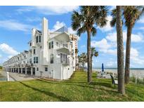 Beachfront townhomes with lush lawn and palms offering stunning ocean views at 17960 Gulf Blvd # 225, Redington Shores, FL 33708
