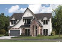 Stunning two-story home featuring stone accents and a modern farmhouse design at 4224 W Corona St, Tampa, FL 33629
