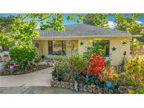 Charming single-story home with a beautiful front yard and well-maintained landscaping at 5100 Aragon S Way, St Petersburg, FL 33705