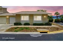 Charming one-story home featuring a neutral color scheme, well-kept landscaping, and an inviting ambiance at 1671 Cape Ann Ne Ave # 4, St Petersburg, FL 33702