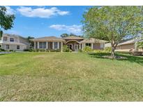 Charming single-story home featuring a well-manicured lawn and inviting facade at 3060 Sutton Woods Dr, Plant City, FL 33566