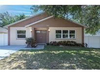 Charming single-Gathering home featuring a well-maintained lawn and inviting double-door entrance at 6328 S Harold Ave, Tampa, FL 33616