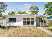 Charming single-story home with a cozy front porch and well-lit windows at 3251 34Th N Ave, St Petersburg, FL 33713