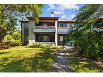 Charming building exterior with well-maintained landscaping and a welcoming entrance at 10265 Gandy N Blvd # 1406, St Petersburg, FL 33702