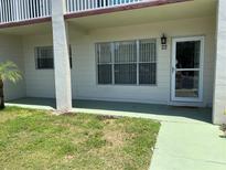 Charming condo with a well-maintained lawn and front entrance with number 22, enhancing curb appeal at 2434 Australia E Way # 22, Clearwater, FL 33763