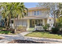 Charming two-story home with mature landscaping, and welcoming front porch with traditional design at 341 14Th Ave Ne, St Petersburg, FL 33701
