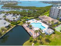 Wonderful aerial view of the community pool, water access, and Intracoastal Waterway views at 1328 Pasadena S Ave # 608, South Pasadena, FL 33707