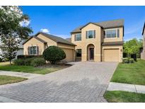 Inviting two-story home featuring a paver driveway and a convenient two-car garage at 19407 Sweet Grass Way, Lutz, FL 33558