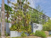 One Laurel Place is a beautiful condo building surrounded by palm trees and lush landscaping at 201 W Laurel St # 504B, Tampa, FL 33602