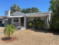 Charming single-story home featuring a landscaped front yard and covered entryway, creating a welcoming curb appeal at 5725 2Nd N Ave, St Petersburg, FL 33710