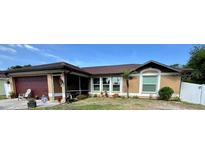 Charming single-story home with well-maintained landscaping and inviting curb appeal at 150 Tompkins St, Port Charlotte, FL 33954