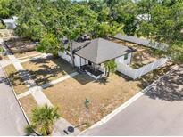 Charming home with well-maintained yard and white picket fence offers a welcoming curb appeal at 2322 21St S St, St Petersburg, FL 33712
