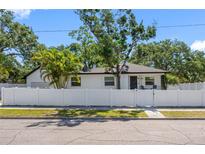 Beautifully landscaped, fenced home features a freshly painted exterior at 2322 21St S St, St Petersburg, FL 33712