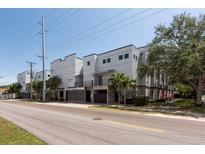 Modern apartment building featuring a clean design with palm trees and well-maintained landscaping at 5008 S Macdill Ave # 10, Tampa, FL 33611