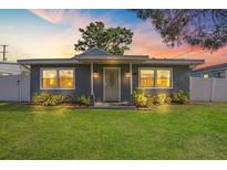 Charming single-story home with a well-maintained lawn and front porch at 11104 Hackney Dr, Riverview, FL 33578