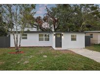 Charming single-story home featuring a freshly painted exterior, updated windows, and a well-manicured front yard at 11747 104Th N St, Largo, FL 33773