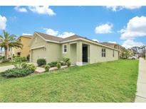 Charming single Gathering home featuring a two-car garage and well-maintained front lawn at 3503 Diamond Leaf Ct, Valrico, FL 33594