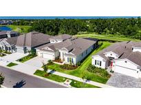 Well-manicured lawn frames this lovely home with a pristine roofline at 6253 Hidden Branch Dr, Apollo Beach, FL 33572