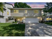 Charming two-story home featuring a two-car garage and a cozy front porch at 1735 Maryland Ne Ave, St Petersburg, FL 33703