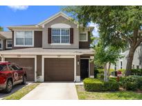 Charming two-story townhome featuring a well-manicured lawn and a private garage at 2131 River Turia Cir, Riverview, FL 33578
