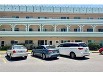 Low-rise condo building with neatly parked cars in the parking area, offering convenient residential living at 2287 Philippine Dr # 29, Clearwater, FL 33763