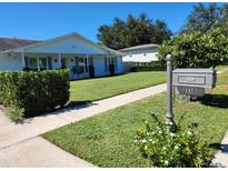 Charming single-story home with a well-manicured lawn and inviting curb appeal at 2310 Medford Ln, Brandon, FL 33511