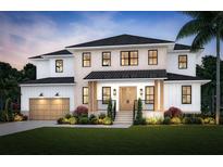 Stunning two-story home featuring a blend of white brick and siding, complemented by a lush, manicured lawn and elegant landscaping at 3622 S Coolidge Ave, Tampa, FL 33629