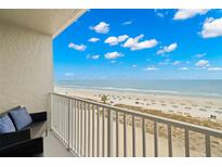Breathtaking ocean view from the condo balcony with comfortable outdoor seating and white railings at 9980 Gulf Blvd # 603, Treasure Island, FL 33706