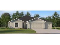 Charming single-story home with a well-manicured lawn and a convenient three-car garage at 10282 Purple Leaf Ct, Riverview, FL 33578