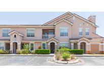 Charming condo featuring a landscaped yard and a classic architectural style with a cozy balcony at 10473 Villa View Cir, Tampa, FL 33647