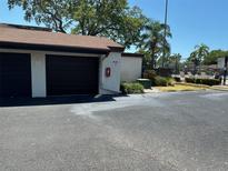 Garage and community pool access point featuring secure parking and convenient amenities for residents at 2055 Sunset Point Rd # 3804, Clearwater, FL 33765