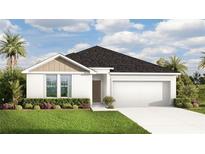 Charming single-story home featuring a two-car garage, well-manicured lawn, and welcoming front entrance at 3269 Reservoir St, North Port, FL 34288