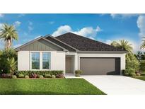 Charming single-story home featuring a well-manicured lawn, two-car garage, and classic architectural details at 4810 Prime Ter, North Port, FL 34286