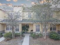 Inviting townhome with stone accents and covered porch, showcasing a well-kept exterior at 222 Draw Bridge Ln, Valrico, FL 33594
