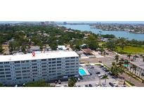 Condominium aerial view shows a building with a pool and a view of the bay at 7321 Central Ave # 503, St Petersburg, FL 33710