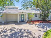 Charming single-Gathering home with a well-manicured lawn and a neutral color palette at 9265 Treasure Ln Ne, St Petersburg, FL 33702