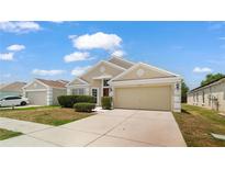 Charming single-story home featuring a two-car garage, well-maintained lawn, and tasteful landscaping at 944 Ridge Haven Dr, Brandon, FL 33511