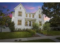 Stunning two-story modern farmhouse exterior with landscaped yard and welcoming front porch at 2218 S Occident St, Tampa, FL 33629