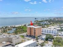 Aerial view of a high-rise condo building near the water featuring city and waterfront views at 1120 North Shore Ne Dr # 201, St Petersburg, FL 33701