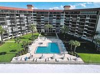 Aerial view of the community pool and lounge area at this condo complex at 18304 Gulf Blvd # 309, Redington Shores, FL 33708