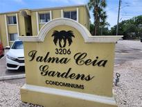 Palma Ceia Gardens condominiums sign welcomes residents and visitors to the community at 3206 W Azeele St # 108, Tampa, FL 33609