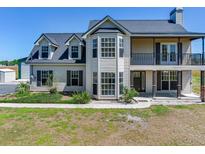 Charming two-story home featuring a balcony, bay windows, and a well-maintained front yard at 3434 E Keysville Rd, Lithia, FL 33547