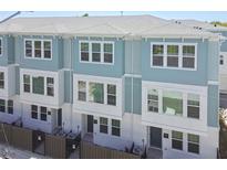 Charming townhome exterior showcases a two-story design with inviting curb appeal at 2123 1St N Ave, St Petersburg, FL 33713