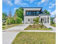 Modern two-story home with a sleek design, manicured landscaping, and a spacious open carport at 3175 10Th N Ave, St Petersburg, FL 33713