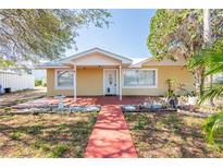 Charming single-story home featuring a well-maintained front yard and inviting entrance at 3823 N 56Th St, Tampa, FL 33619
