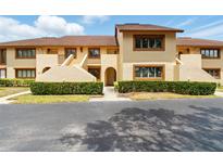 Charming townhouse featuring a well-maintained facade and mature landscaping at 8005 Bardmoor Pl # 102I, Seminole, FL 33777