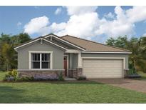 Charming single-story home featuring stone accents, a neatly landscaped yard, and an attached two-car garage at 11500 Myakka Blue Dr, Venice, FL 34293