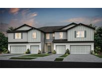 New construction exterior elevation showing 2-story townhome with attached garages and neutral paint scheme at 13084 Stillmont Pl, Tampa, FL 33624
